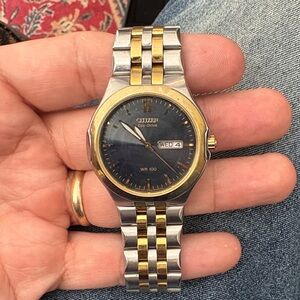 Citizen Eco-Drive Gold and Silver Watch with Black Dial